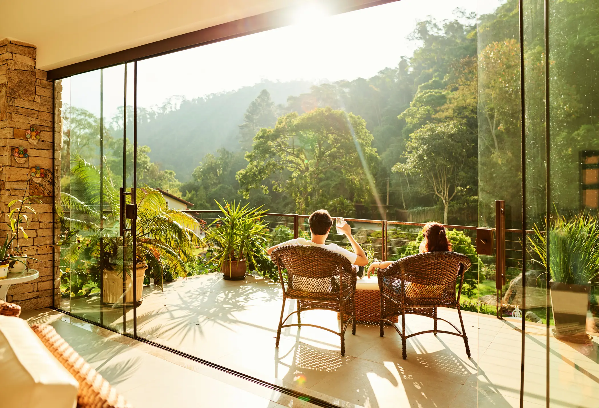 Couple relaxing on patio with mountain view